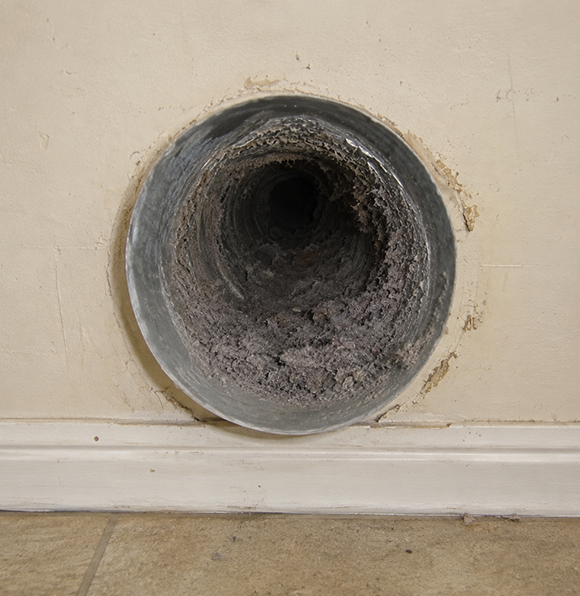 Dirty dryer vent clogged with lint buildup